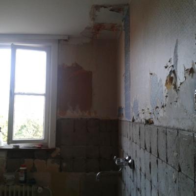 the wall in the kitchen before I had done anything with it except knock super ugly old tiles off