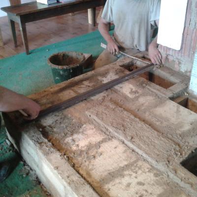 measuring the supports for the mud bricks