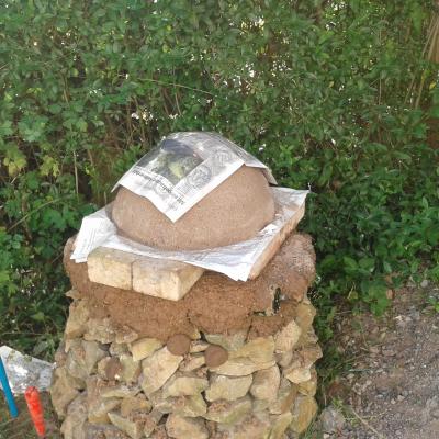 the sand dome with some newspaper